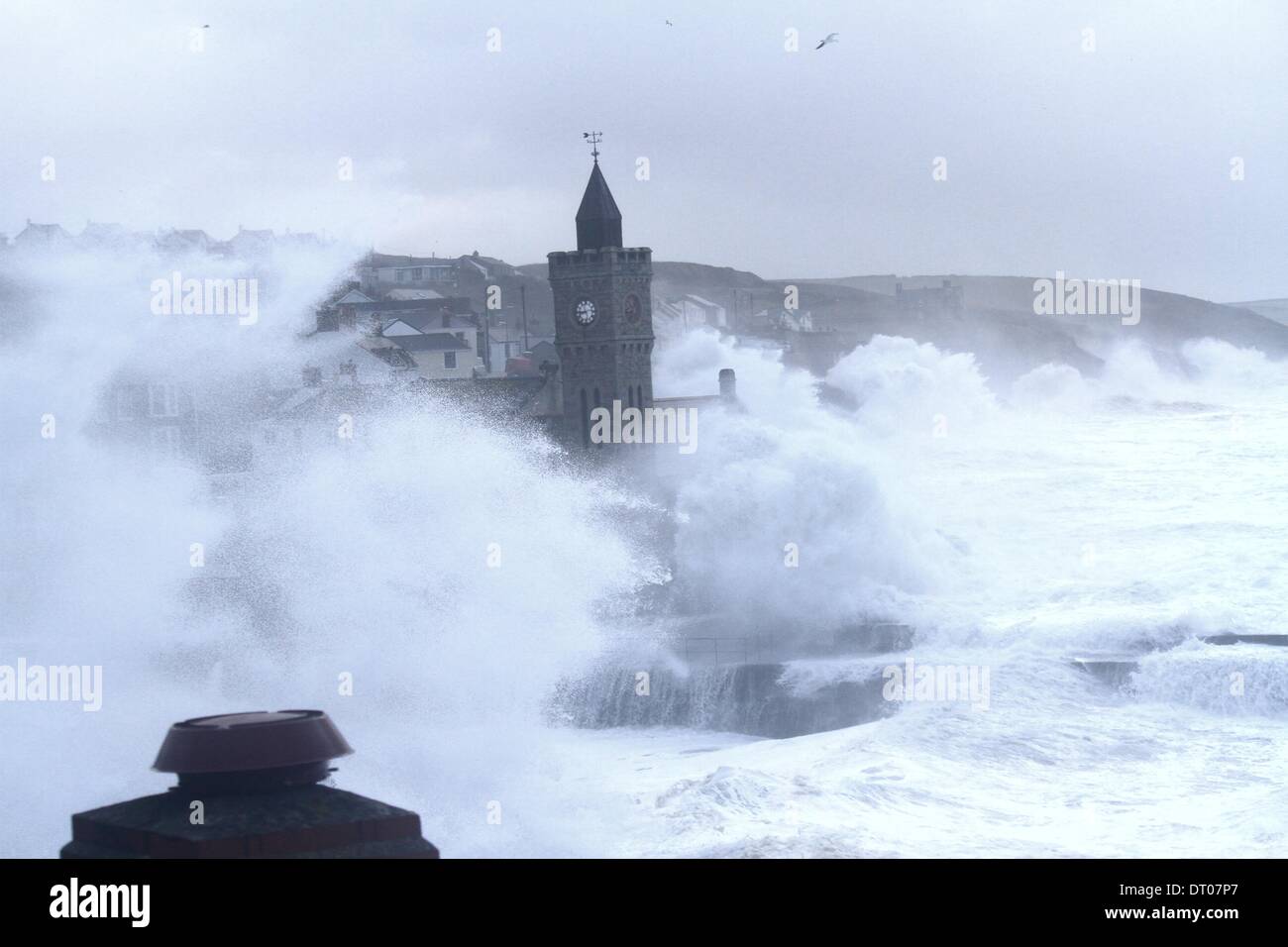 Porthleven, UK. 5th Feb, 2014. Some of the biggest waves crash down on the Cornish Coast during high tide in the early hours of Wednesday morning, 5th February, sinking at least 4 boats in Porthleven Harbour and causing damage to many different buildings. There appears to be no end to the stormy weather with high winds forecast for the weekend. Credit:  Remy Boprey/Alamy Live News Stock Photo