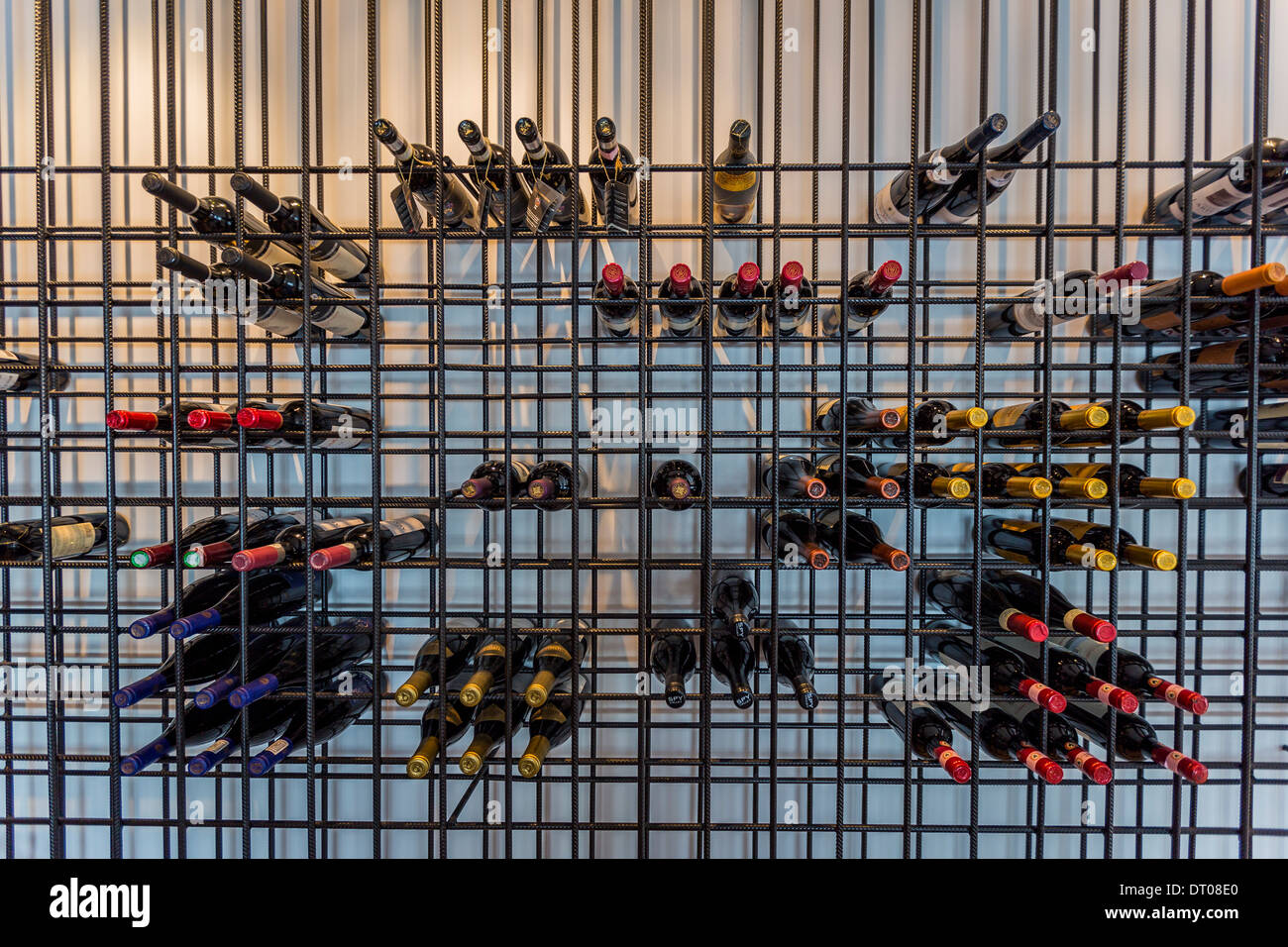 Wine bottles on a rack in a restaurant, Reykjavik Iceland Stock Photo