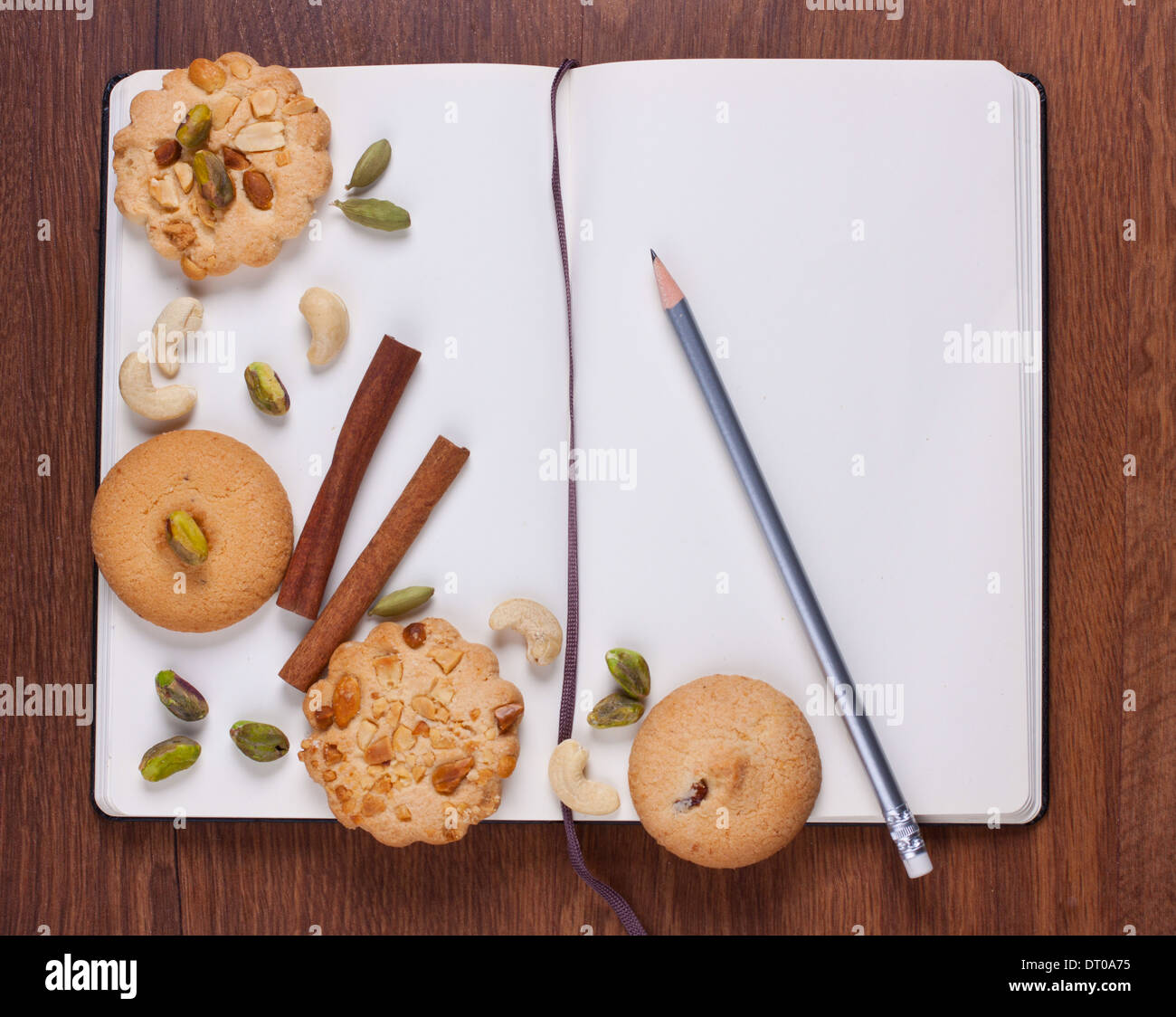 Blank recipe book with nuts and cookies Stock Photo