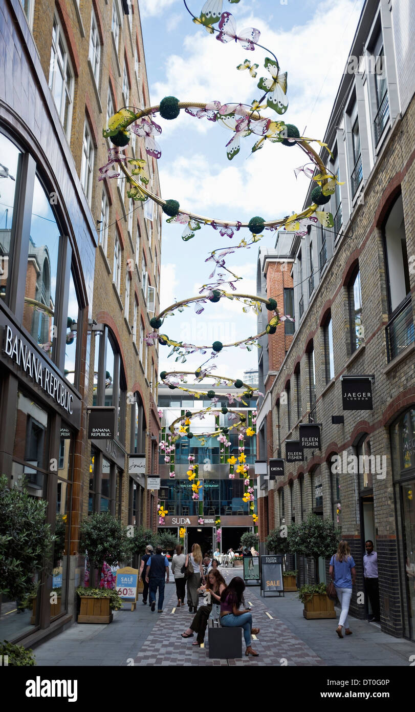 Row of retail shops on Slingsby Place, Covent Garden, London. Stock Photo