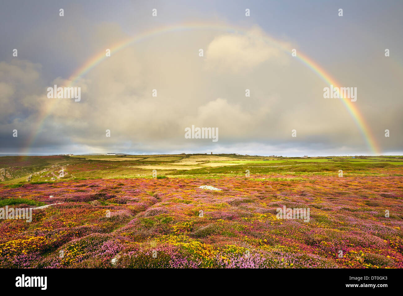 A full rainbow above the heathland at Land's End Stock Photo