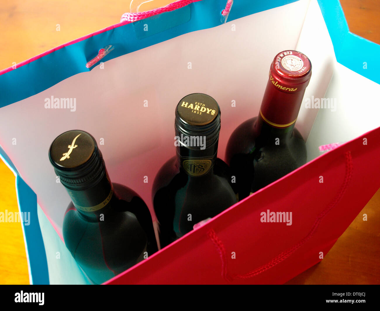 Three wine bottles in a gift bag, Stock Photo