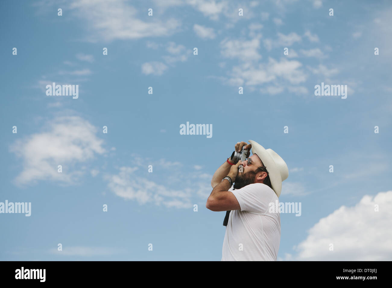 Nevada USA Man taking photograph of clouds and sky Stock Photo