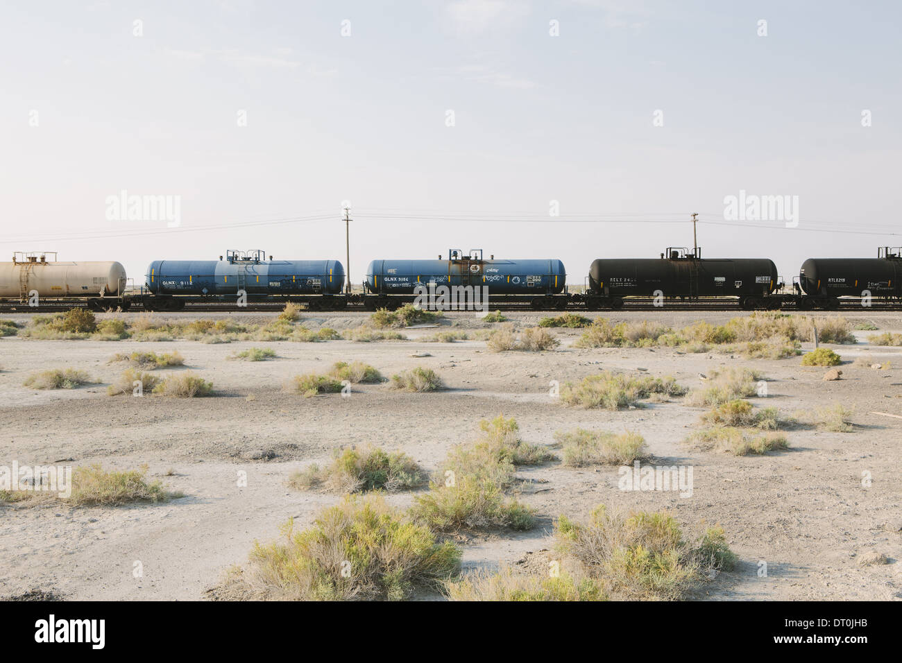 Utah USA goods train on train track running through desert Stock Photo