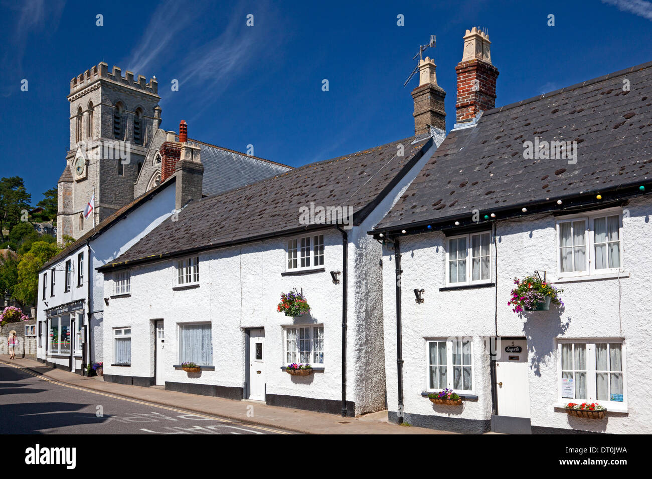 St Michael's Church alongside whitewashed houses, Beer, Devon Stock
