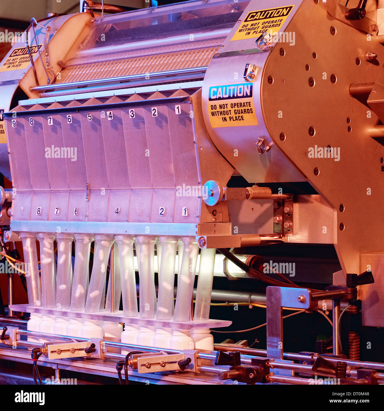 The pill counter in a pharmaceutical processing facility. Stock Photo