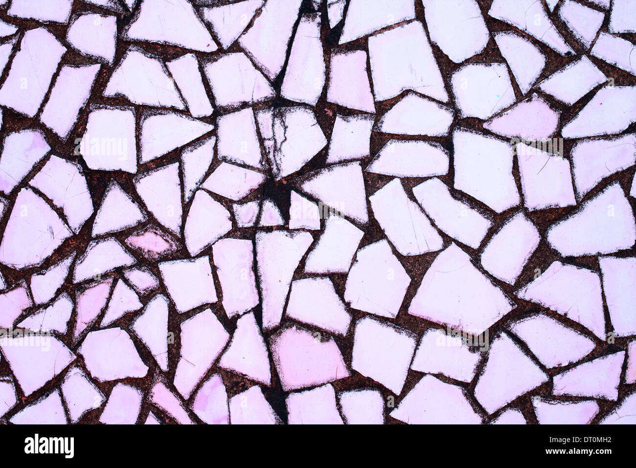 Texture of stone wall with mosaic tiles close-up Stock Photo