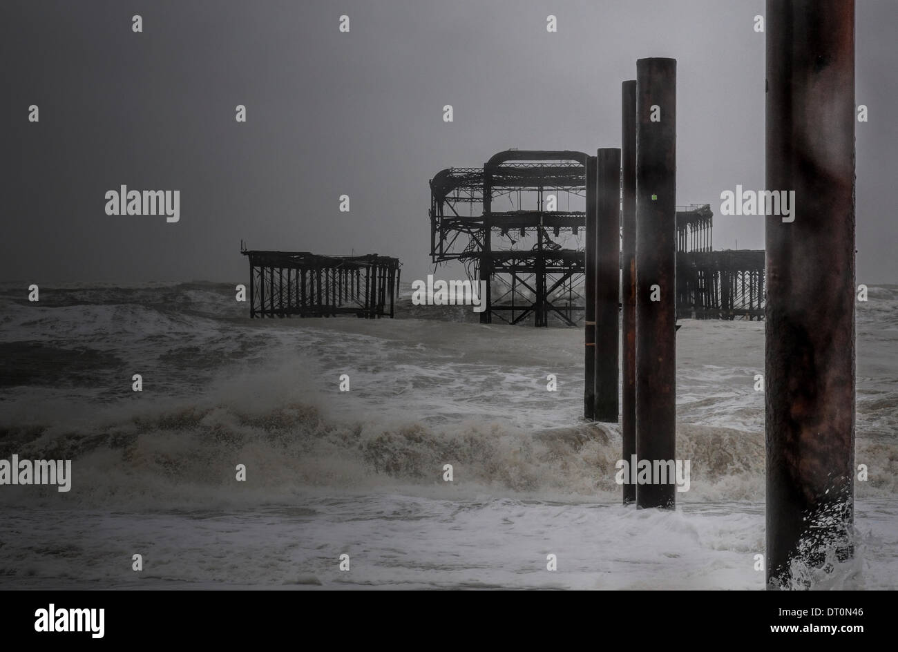 Brighton, Sussex, UK. 5th February 2014. Another view of the old pier as more of the structure is lost to the sea as more storms batter the South Coast Credit:  David Burr/Alamy Live News Stock Photo