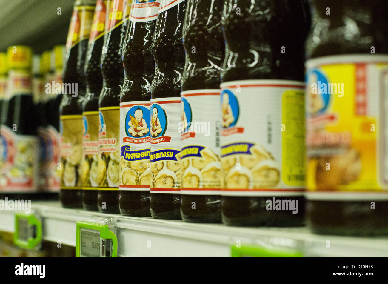 Oyster sauce and condiment on shelf of supermarket in Bangkok of Thailand. Stock Photo