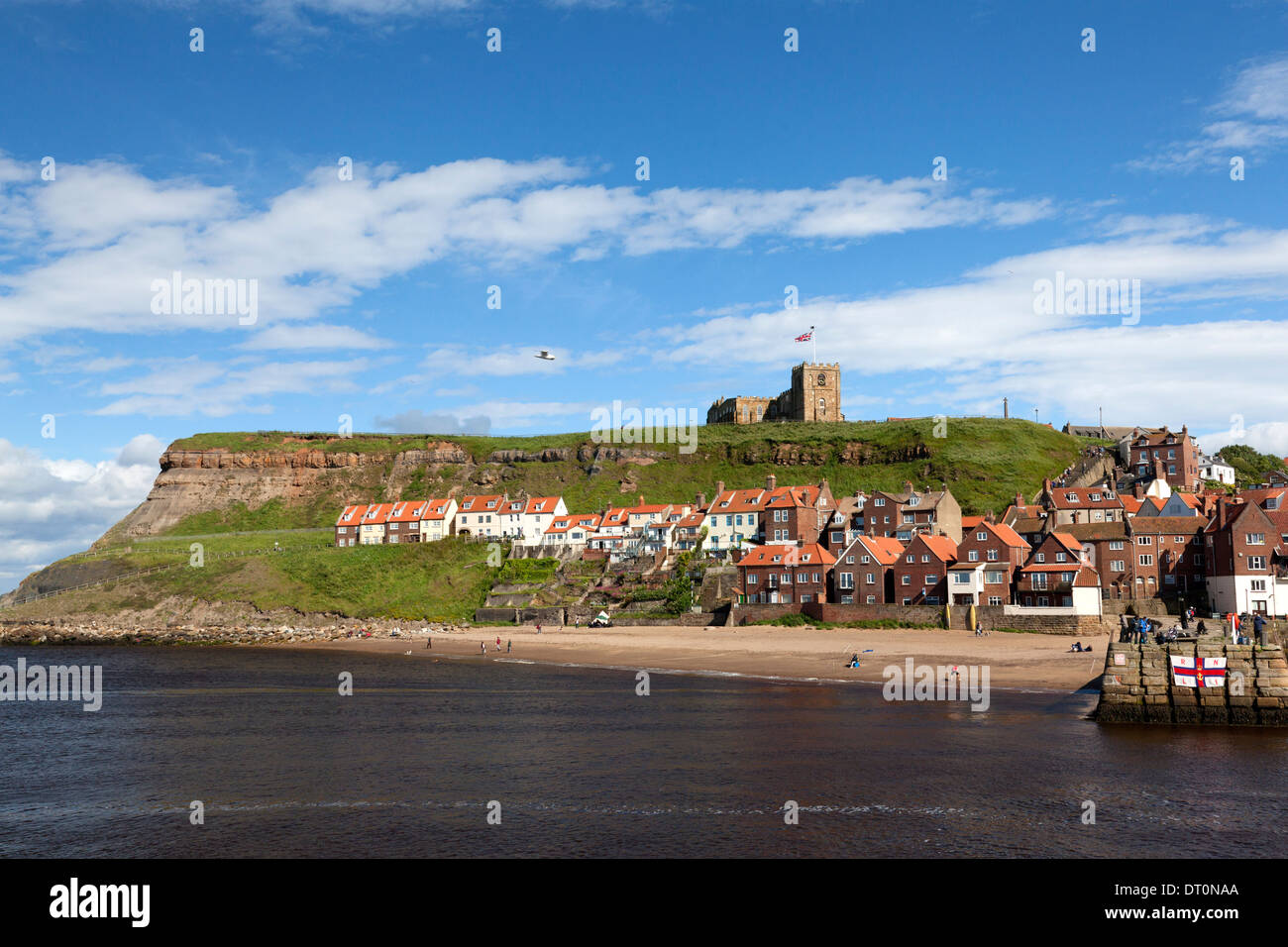 Whitby harbour with East Cliff and St Mary's Church, Whitby, North Yorkshire Stock Photo