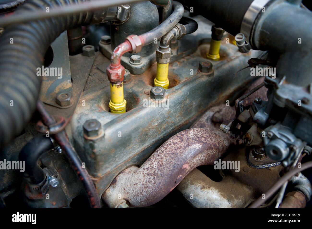 Yellow spark plugs in an old military jeep engine Stock Photo