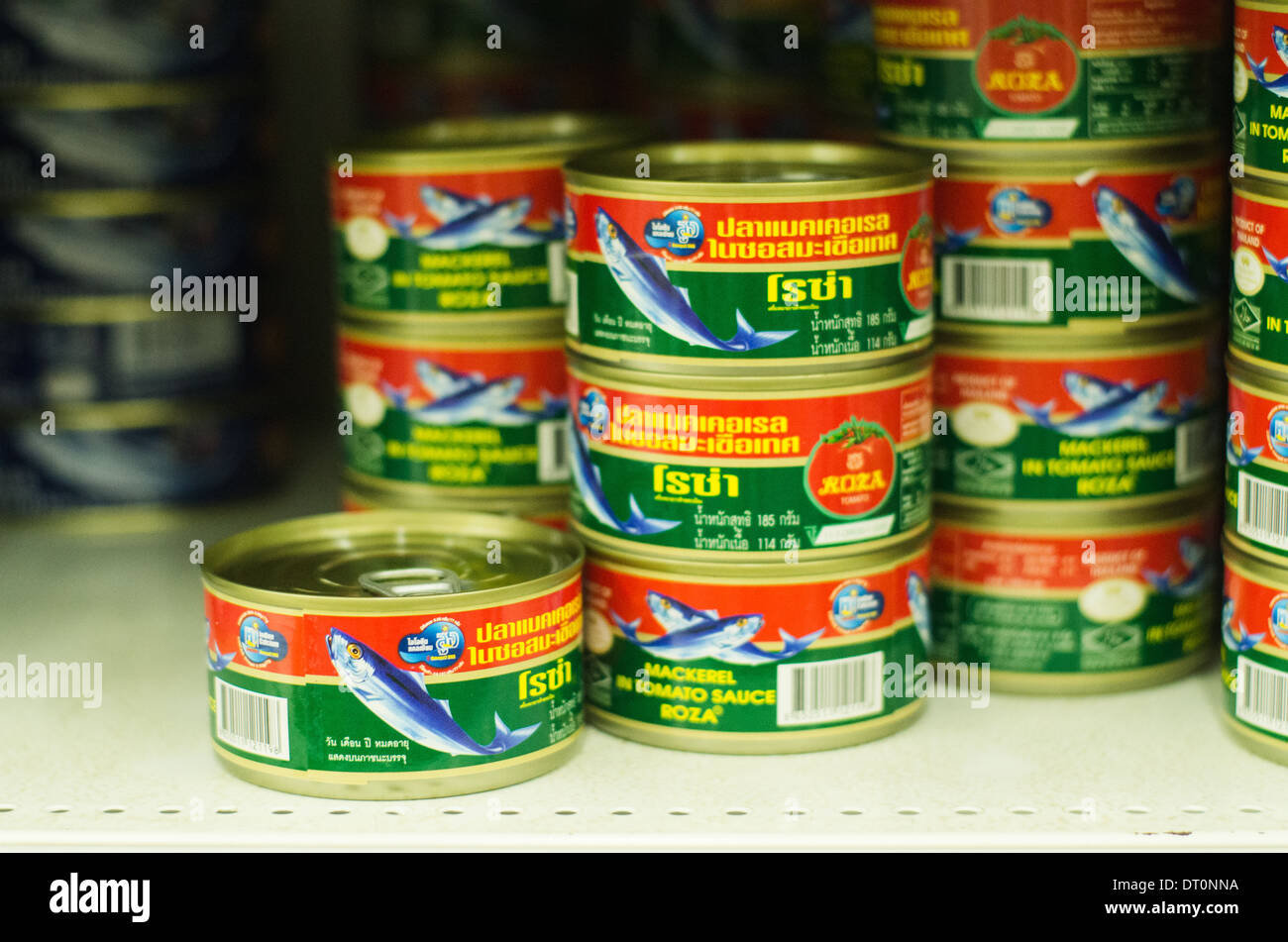 sardine fish cans on shelf of thailand grocery supermarket Stock Photo