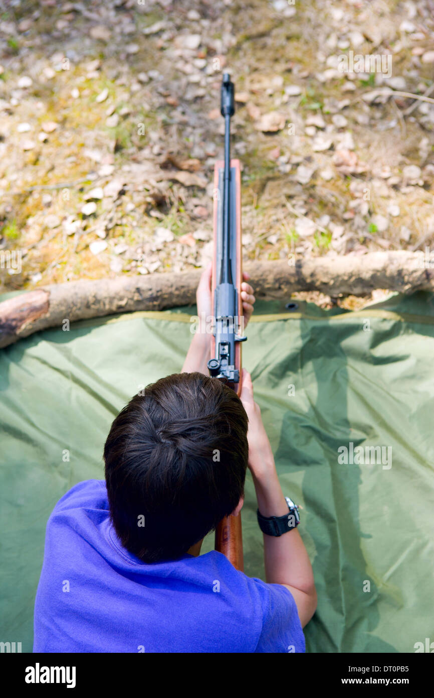 Boy shooting gun Stock Photo Alamy