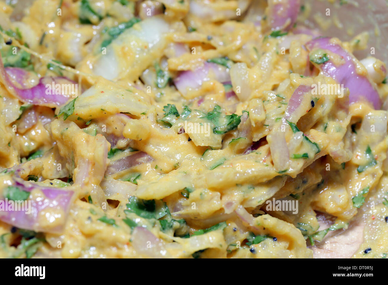Batter for onion bhajis, made with onions and spices mixed with besan