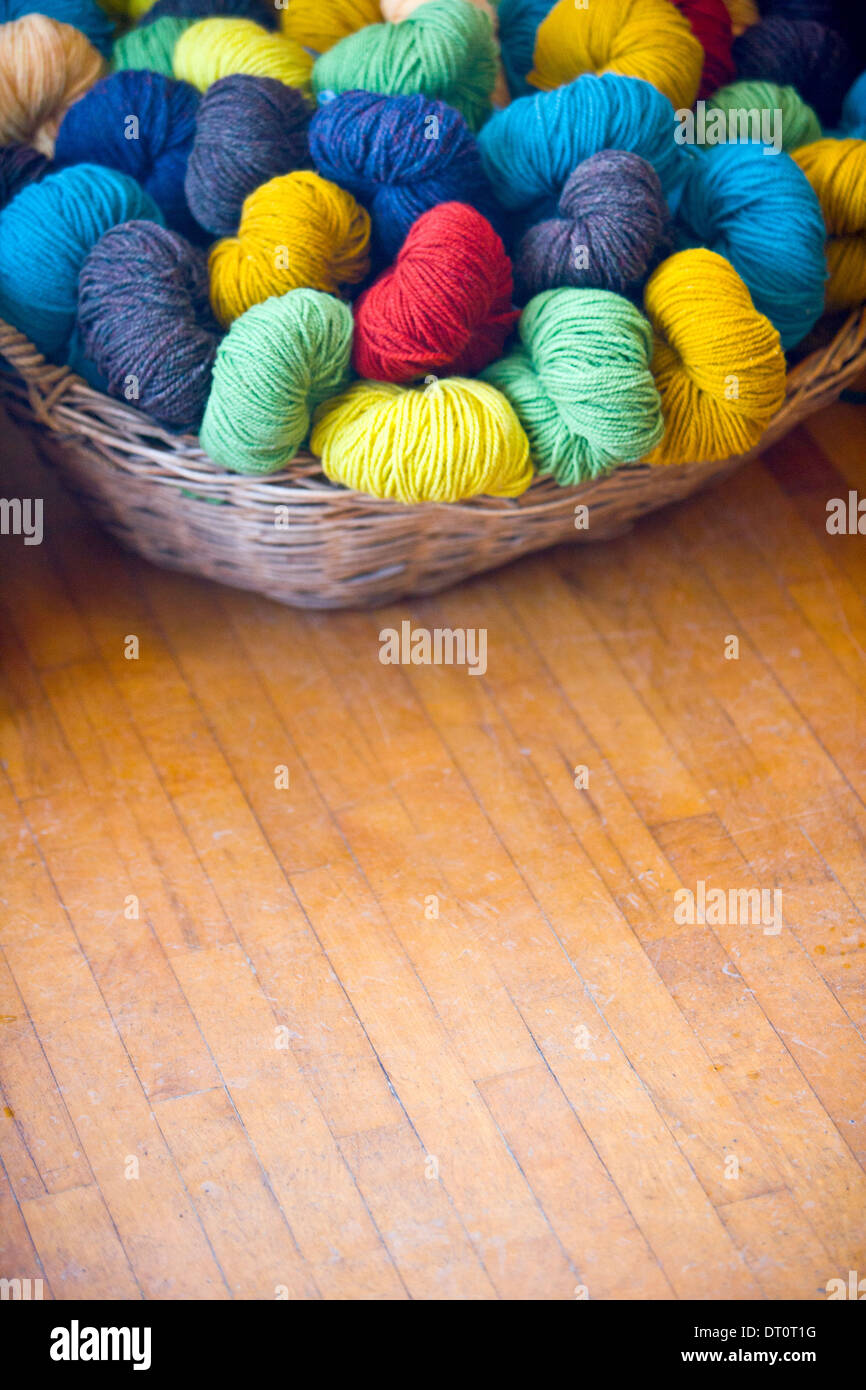 Wicker basket of  yarn wool skeins Stock Photo