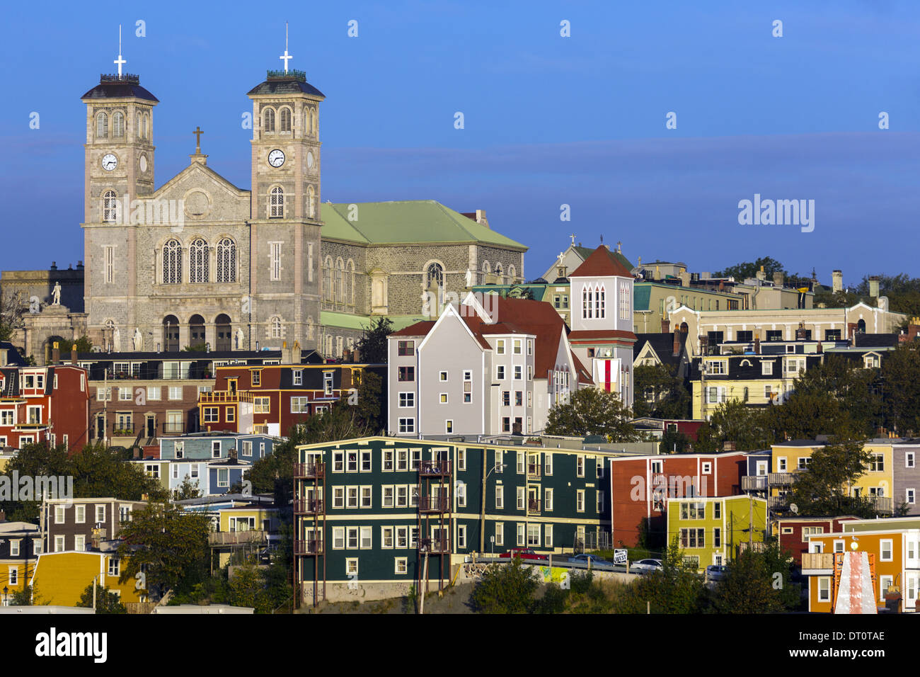 Anglican Cathedral of St. John the Baptist overlooks the coloured houses of downtown town of St John's, Newfoundland, Canada Stock Photo