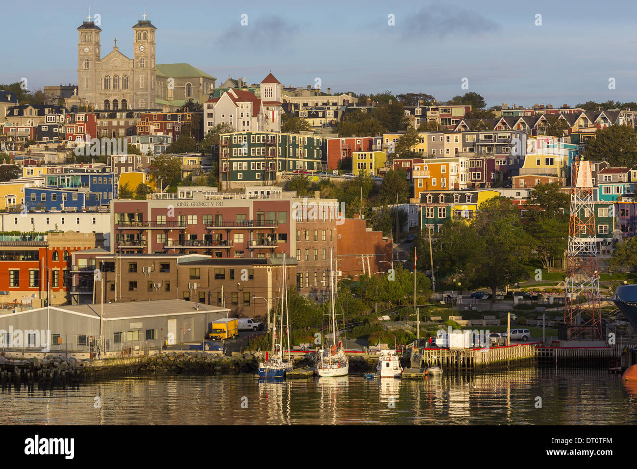 Anglican Cathedral of St. John the Baptist overlooks the coloured houses of downtown town of St John's, Newfoundland, Canada Stock Photo