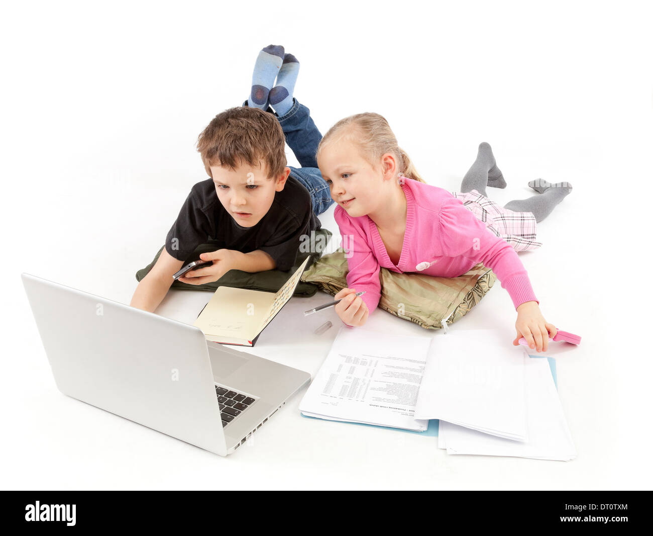Child Boss and his child Secretary watching the Laptop and call Stock Photo