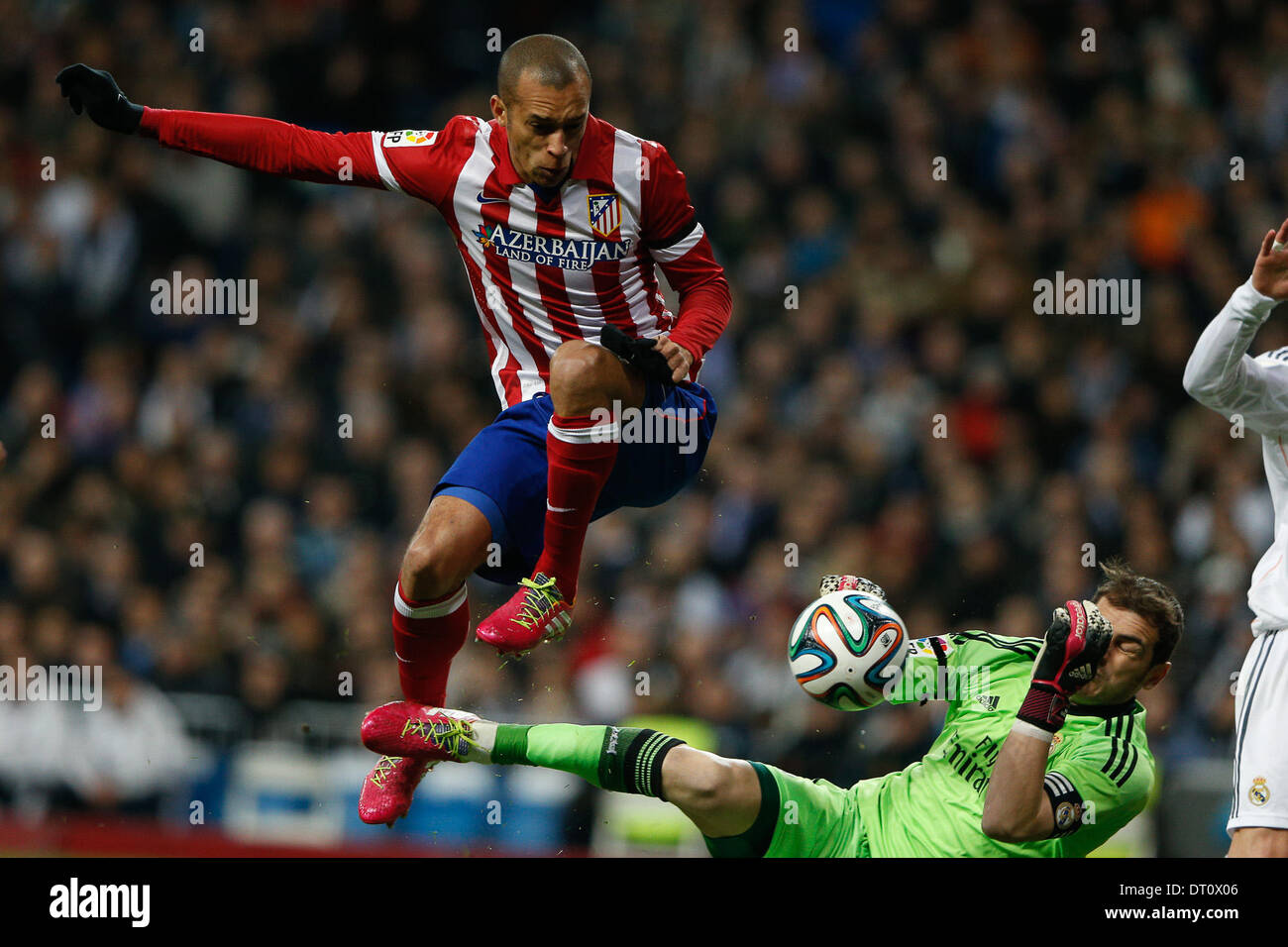 Madrid, Spain. 05th Feb, 2014. Copa del Rey first leg match Real Madrid CF versus Atletico de Madrid match at the Santiago Bernabeu Stadium. The picture show Iker Casillas (spanish goalkeeper of Real Madrid) and Joao Miranda de Souza (Brazilian defender of At. Madrid) Credit:  Action Plus Sports/Alamy Live News Stock Photo