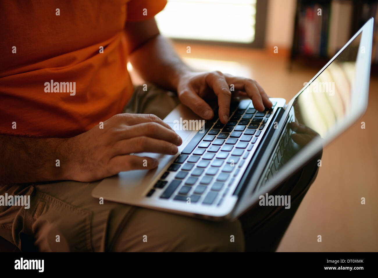 Young man using laptop computer at home Stock Photo - Alamy