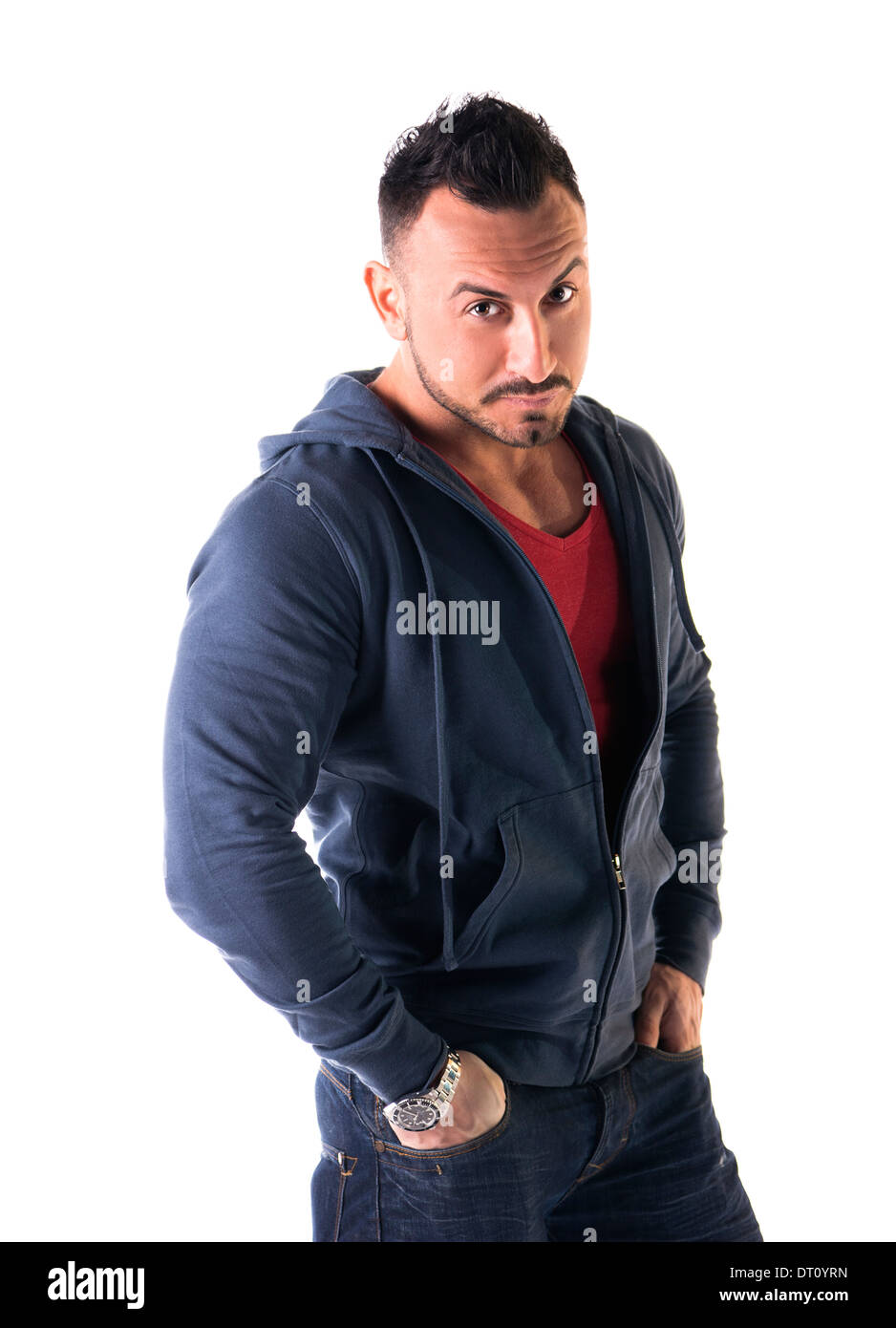 Muscular man with sweatshirt, hands in his pockets, looking at camera, isolated on white Stock Photo