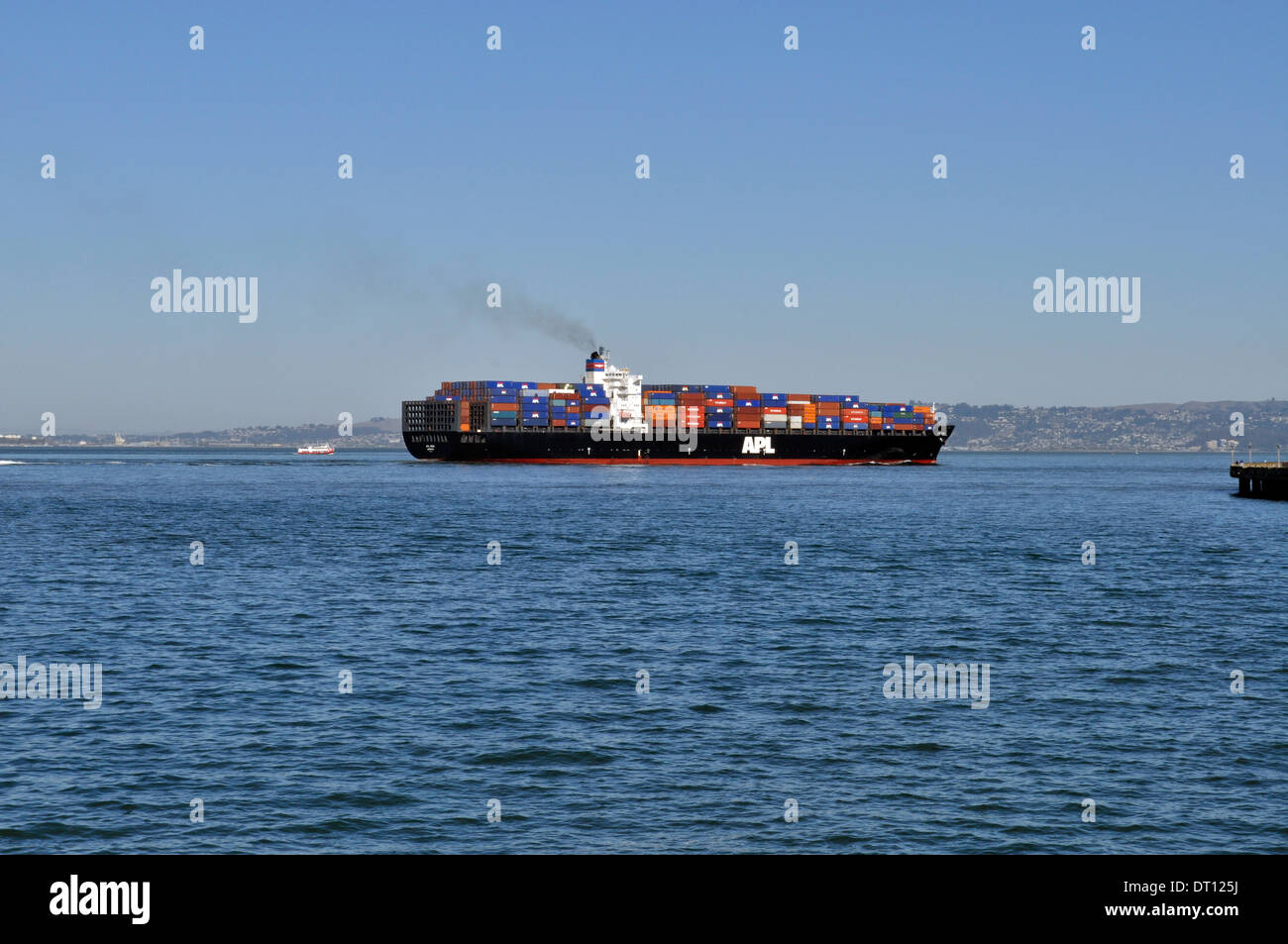 Container cargo ship sails into San Francisco Bay Stock Photo