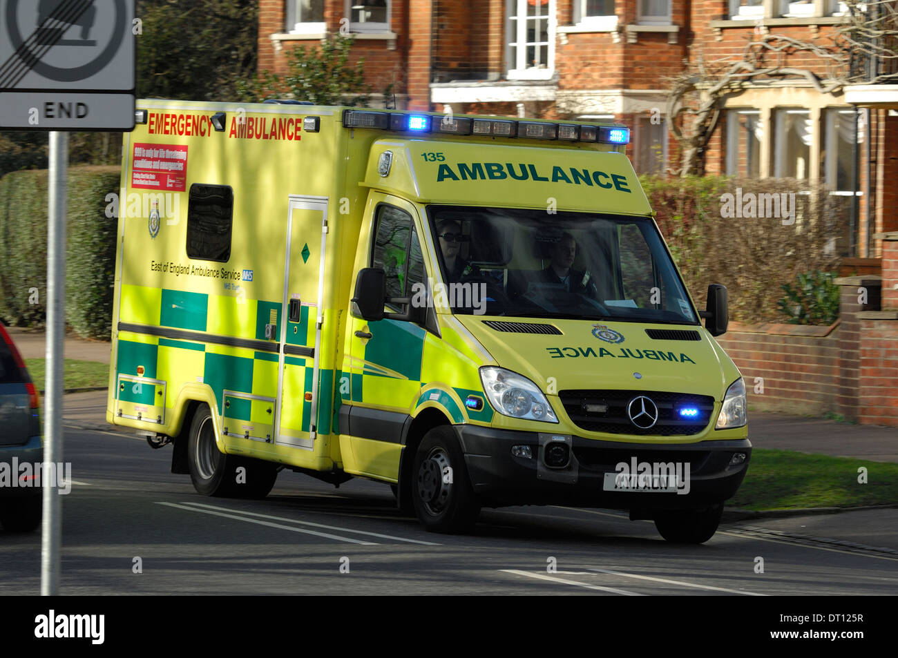 Ambulance attending a call with flashing blue lights, Bedford UK Stock Photo