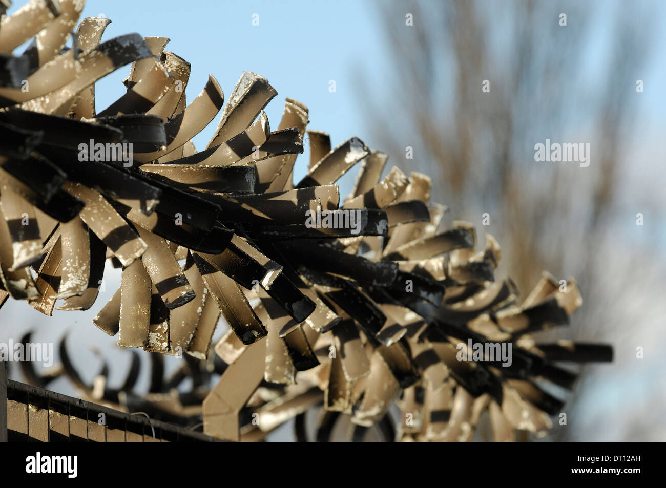 Spinning metal blades of a security fence Stock Photo Alamy