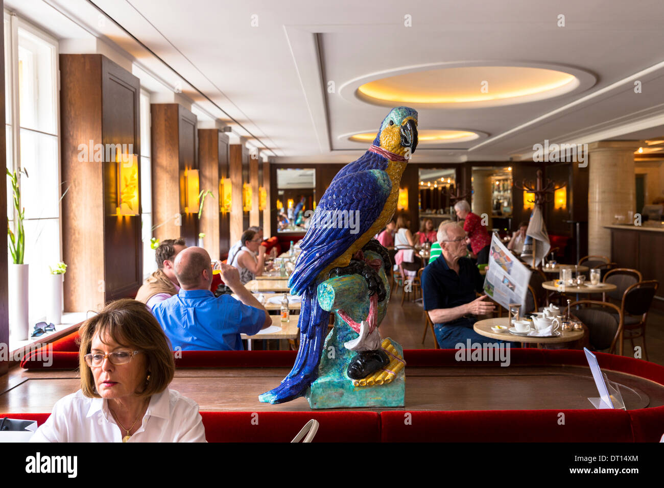 Macaw ornament in Cafe-Bistro at Dallmayr food store in Munich in Bavaria, Germany Stock Photo