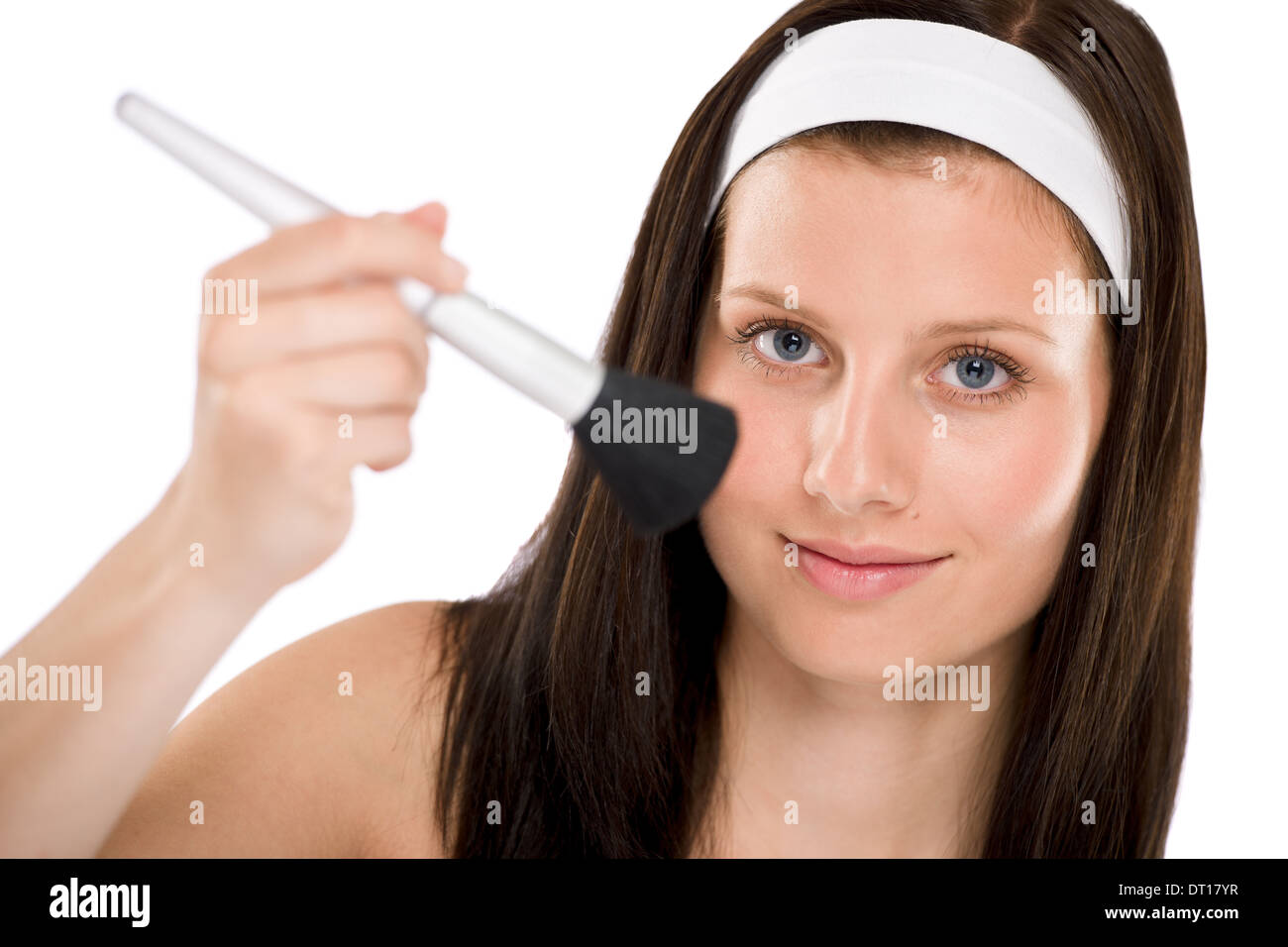 Beautiful woman holding make-up brush Stock Photo