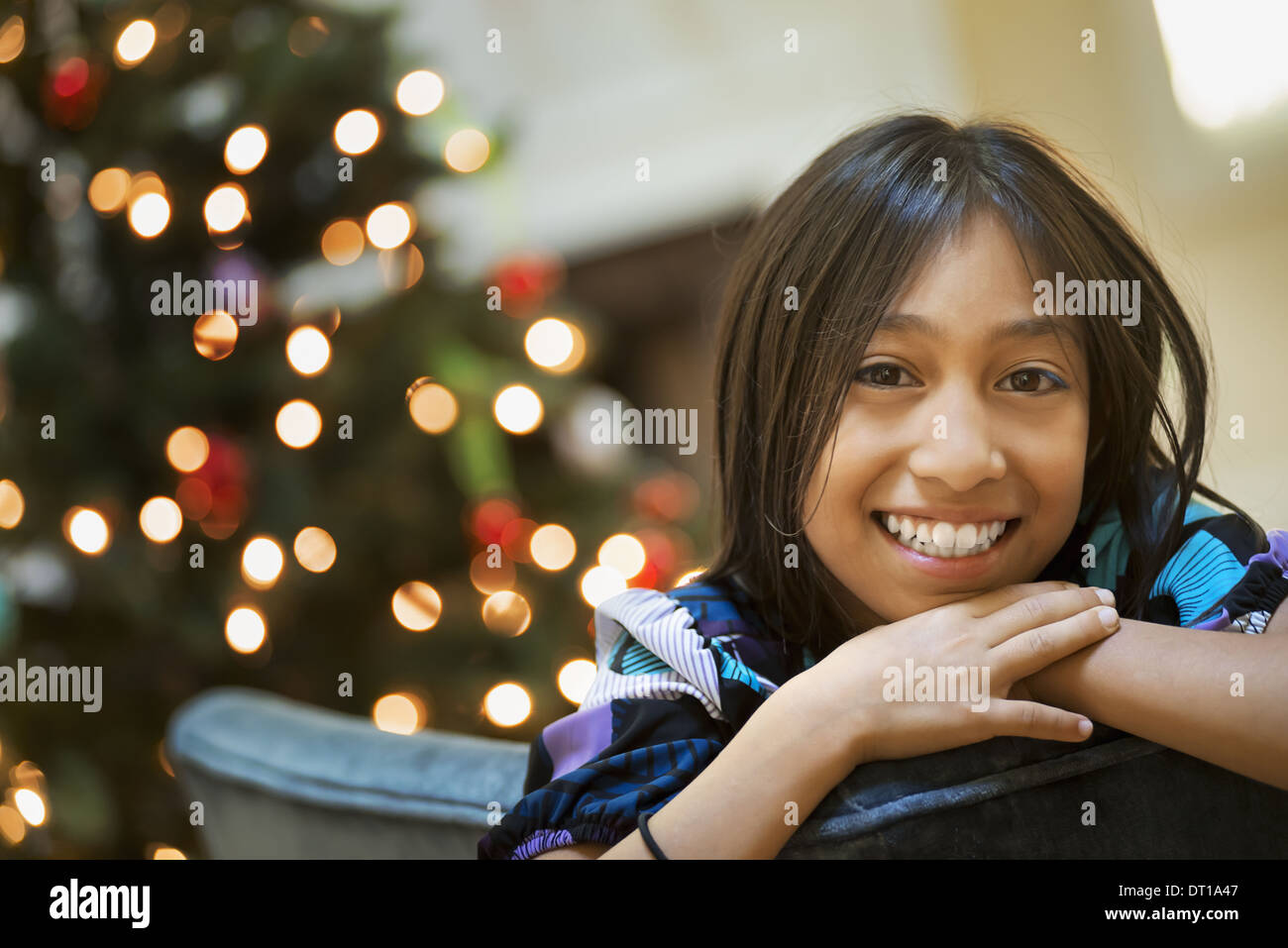 Woodstock New York USA young girl smiling in front of Christmas tree