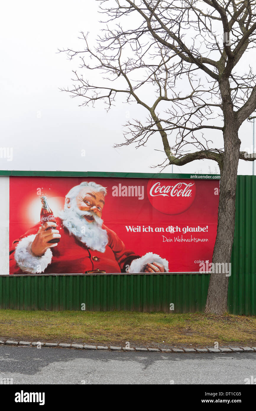 Poster of Santa Claus Coca Cola advertising in a street Stock Photo