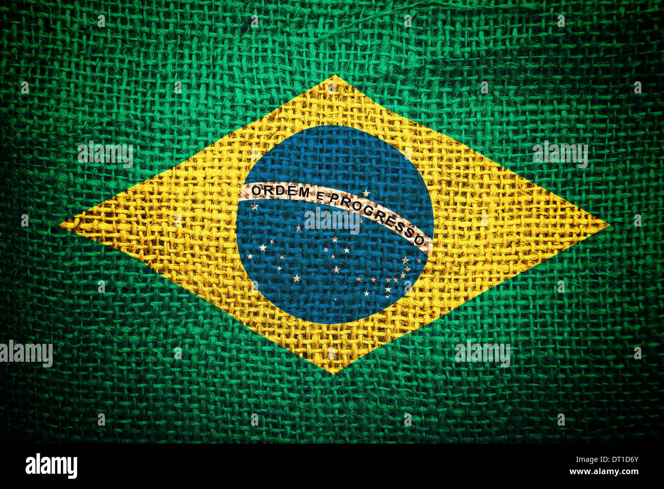 Brazil flag on coffee sack texture. Concept of raw coffee beans import and export. Stock Photo