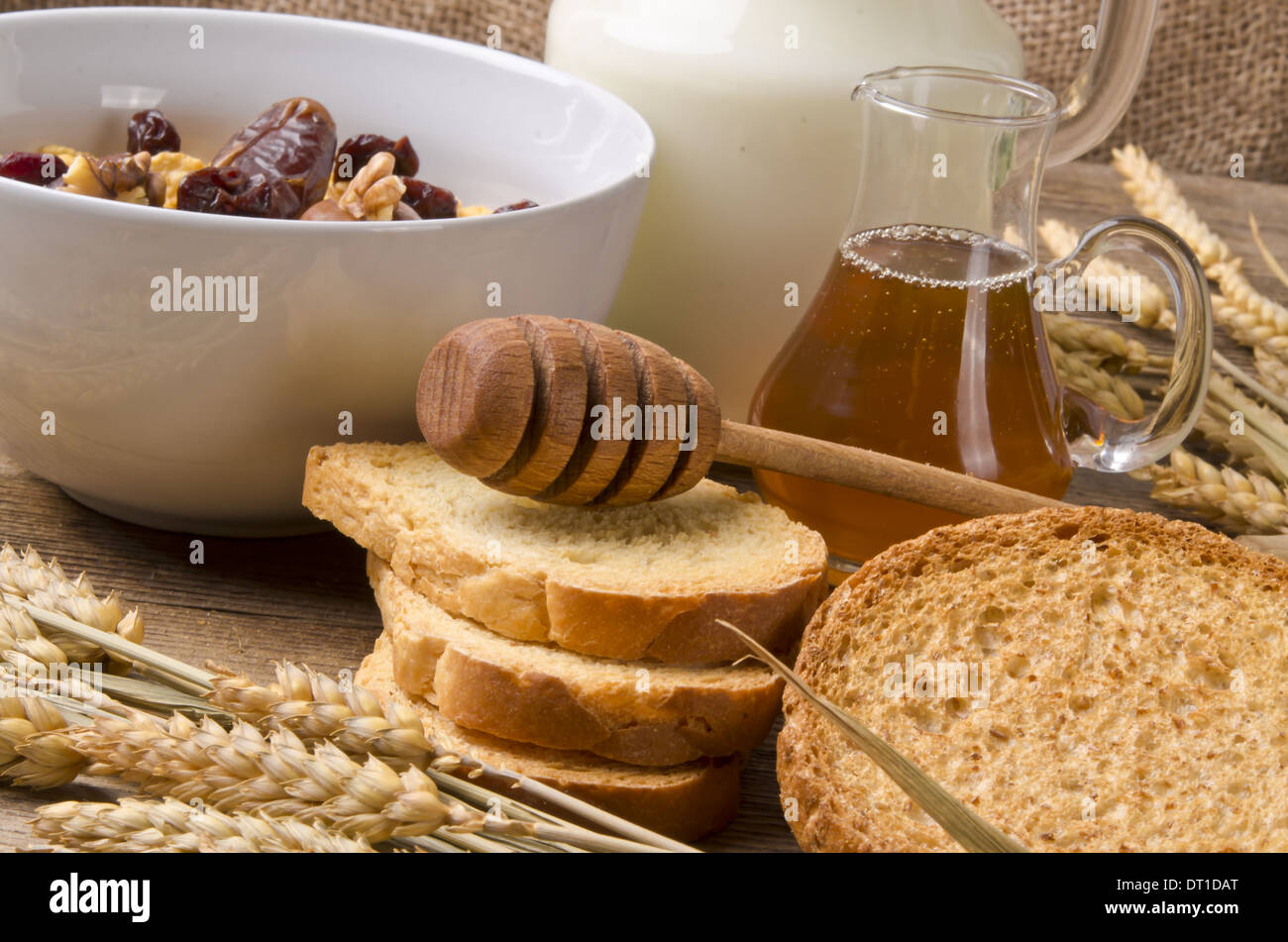 Muesli with low-fat milk and rusk Stock Photo