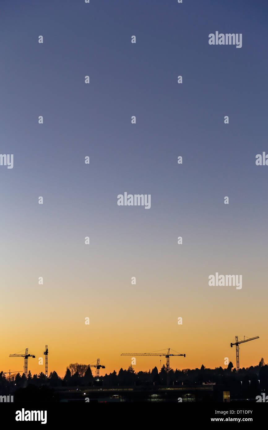 Construction Cranes at Dusk in South Vancouver, Canada Stock Photo