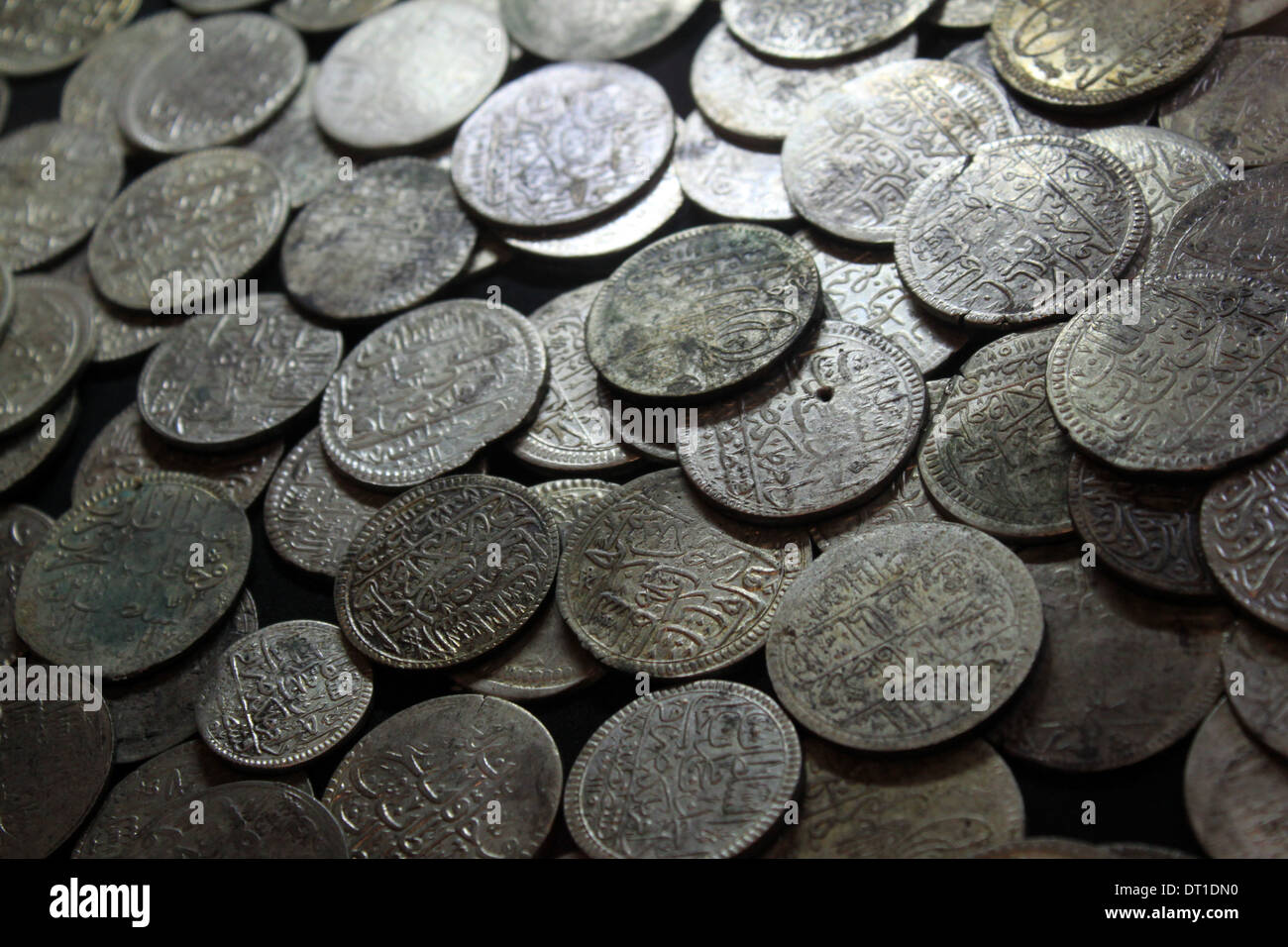 Examining antique silver coin Stock Photo - Alamy