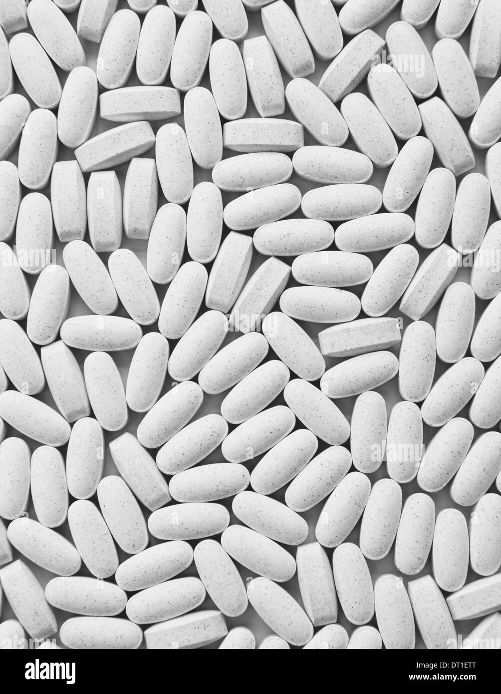 Vitamin C supplements white oval tablets taken for health reasons Stock