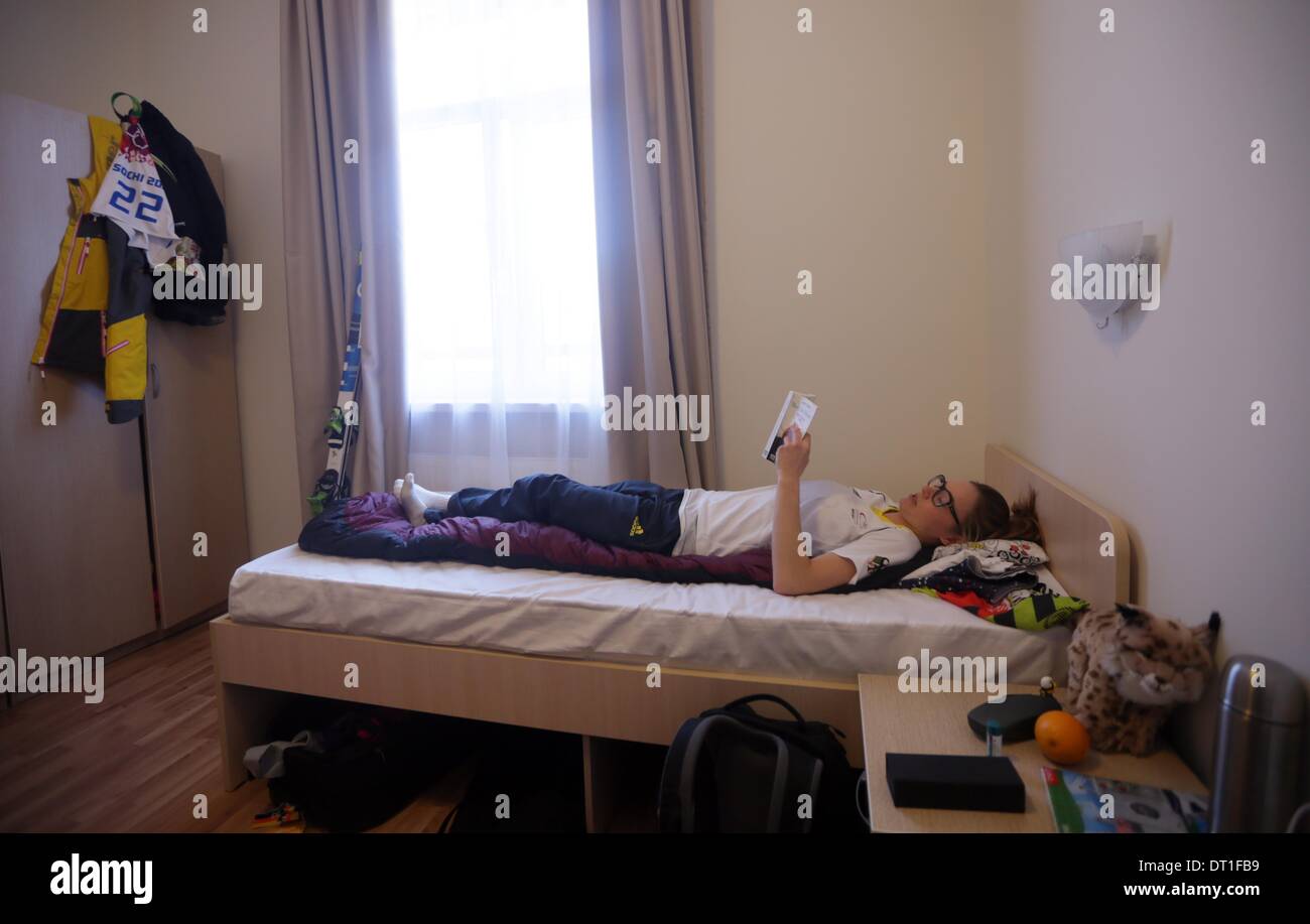 Sochi, Krasnodar region, Russia. 06th Feb, 2014. Freestyle skier Laura Grasemann of Germany reads a book in her room in a house of the German team in the Mountain Olympic Village «Derevnya» at the Rosa Khutor Alpine Resort near Sochi, Krasnodar region, Russia, 06 February 2014. The Olympic Winter Games 2014 in Sochi run from 07 to 23 February 2014. Photo: Michael Kappeler/dpa/Alamy Live News Stock Photo