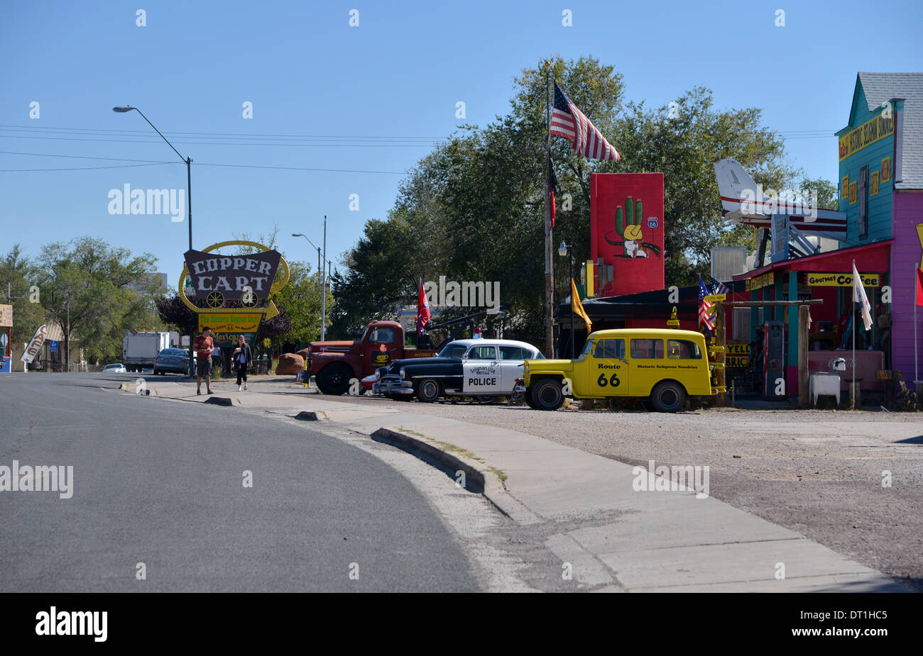 Classic cars parked outside historic Route 66 tourist attractions in Seligman, Arizona. Police car, Jeepster, truck Stock Photo