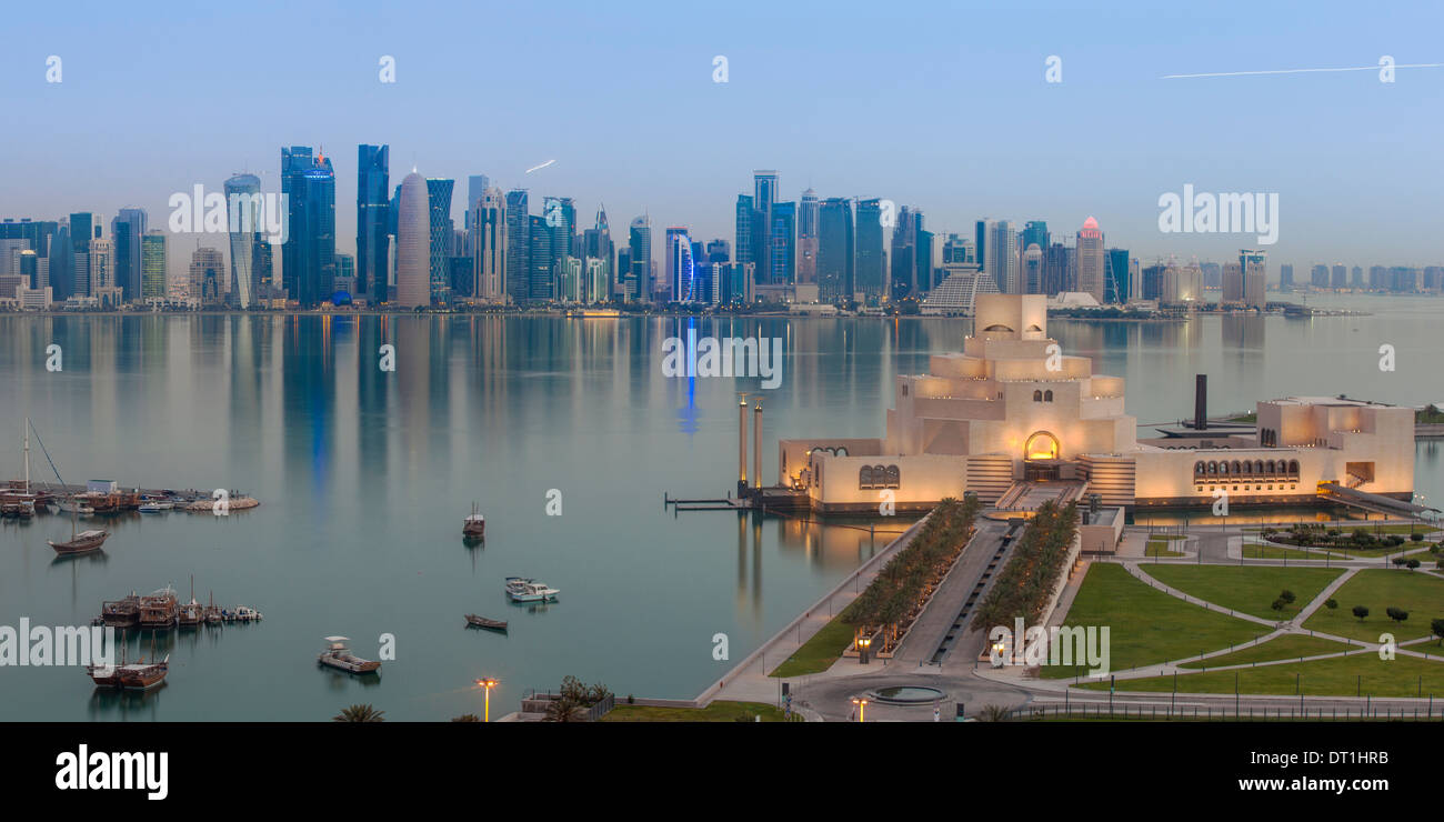 Museum of Islamic Art with West Bay skyscrapers in background, Doha, Qatar, Middle East Stock Photo