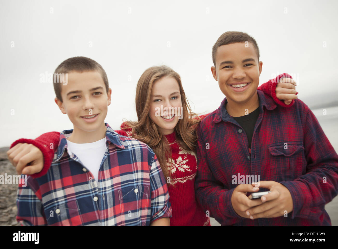 Three boys standing in a row hi-res stock photography and images - Alamy