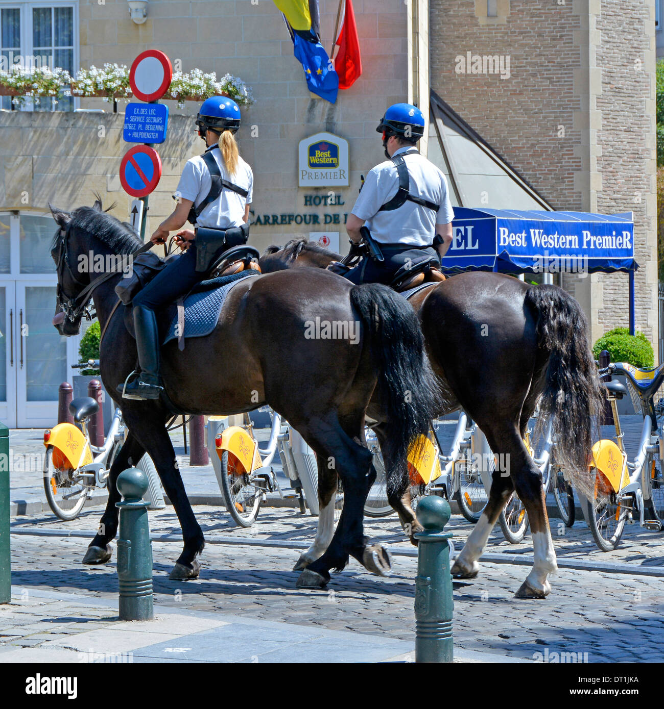 Mounted police officers patrolling on horseback in Brussels Belgium Stock Photo