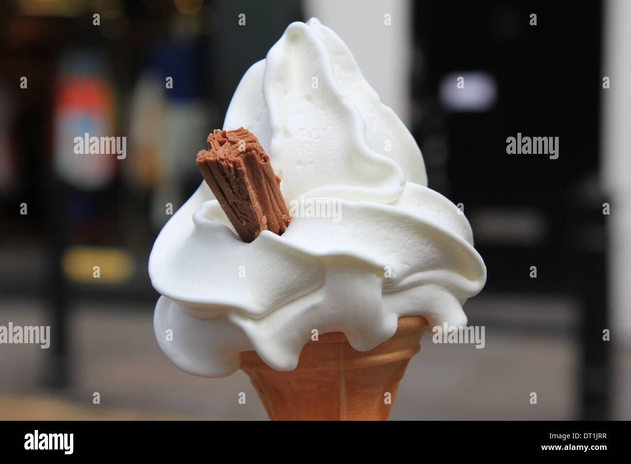 Creamy ice-cream cone with chocolate flake, London Stock Photo
