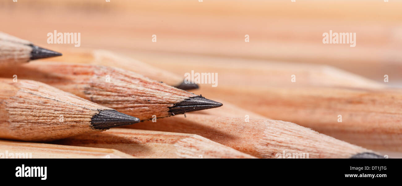 Graphite wooden pencils for sketching shot closeup background Stock