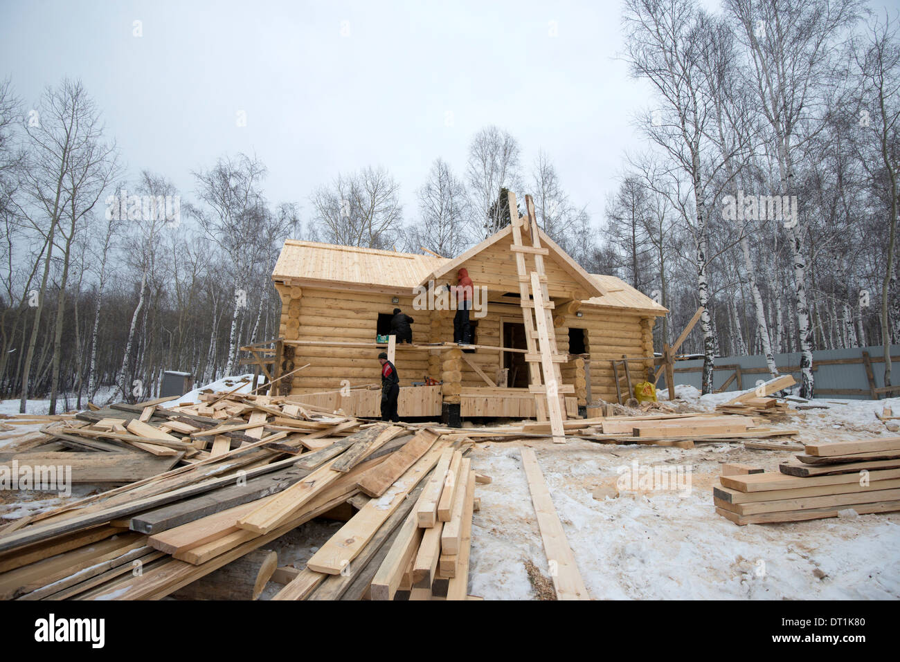 Building traditional wooden cabin in the Siberian Taiga forest, Irkutsk Oblast, Russia, Eurasia Stock Photo