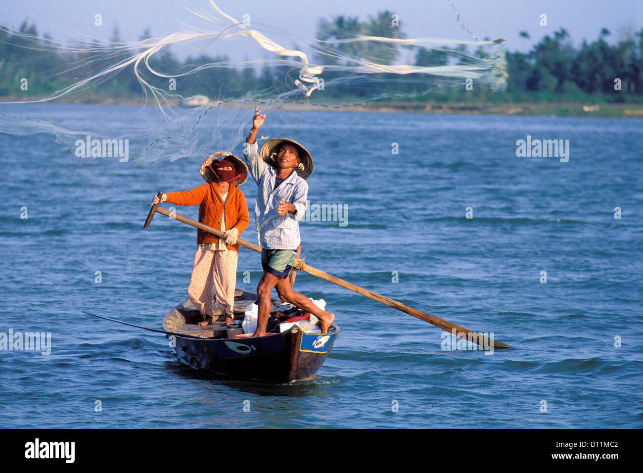 Fisherman casting net, Hoi Han, Vietnam, Indochina, Southeast Asia, Asia Stock Photo
