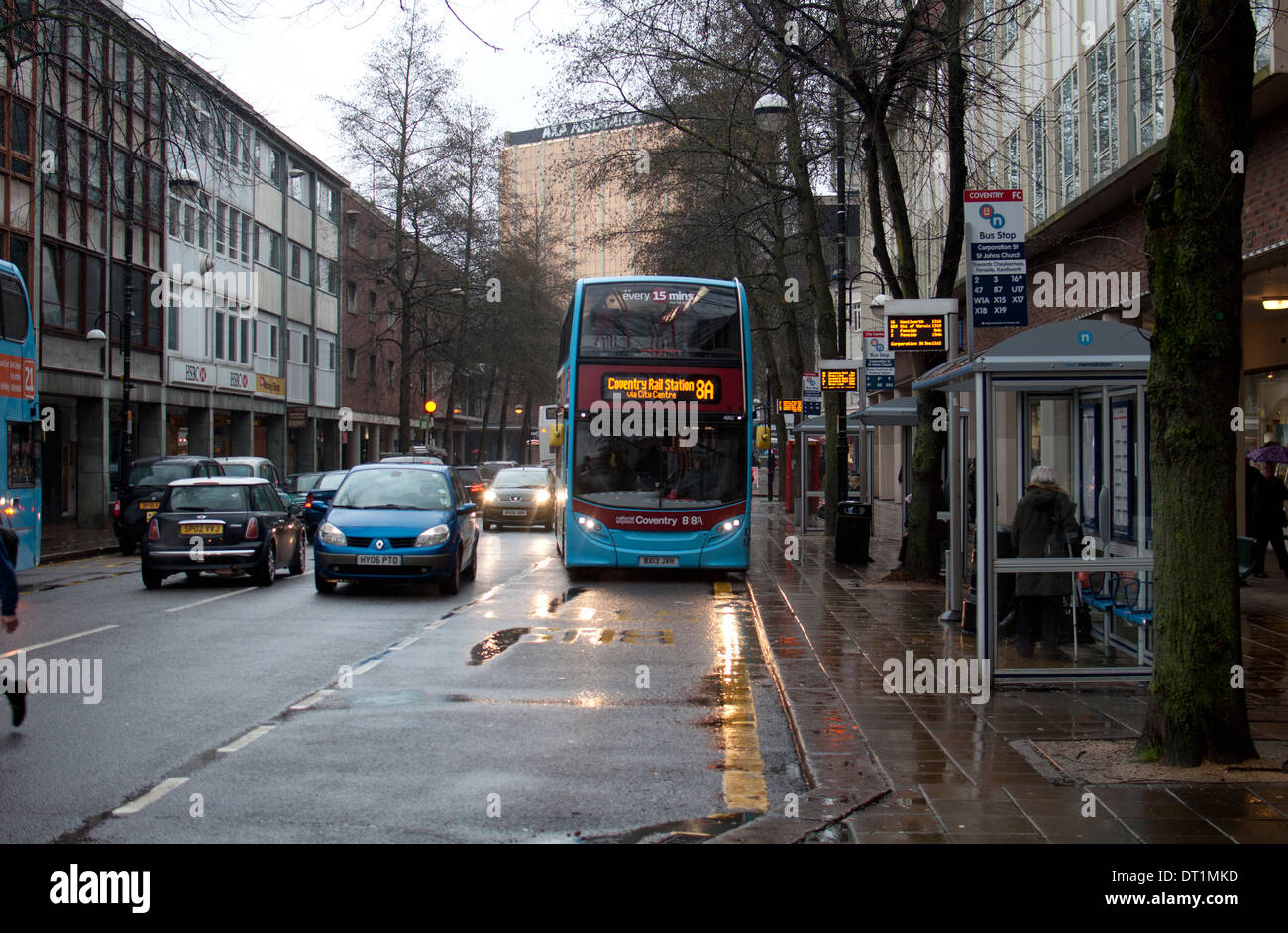 Bus in wet weather, Coventry city centre, UK Stock Photo