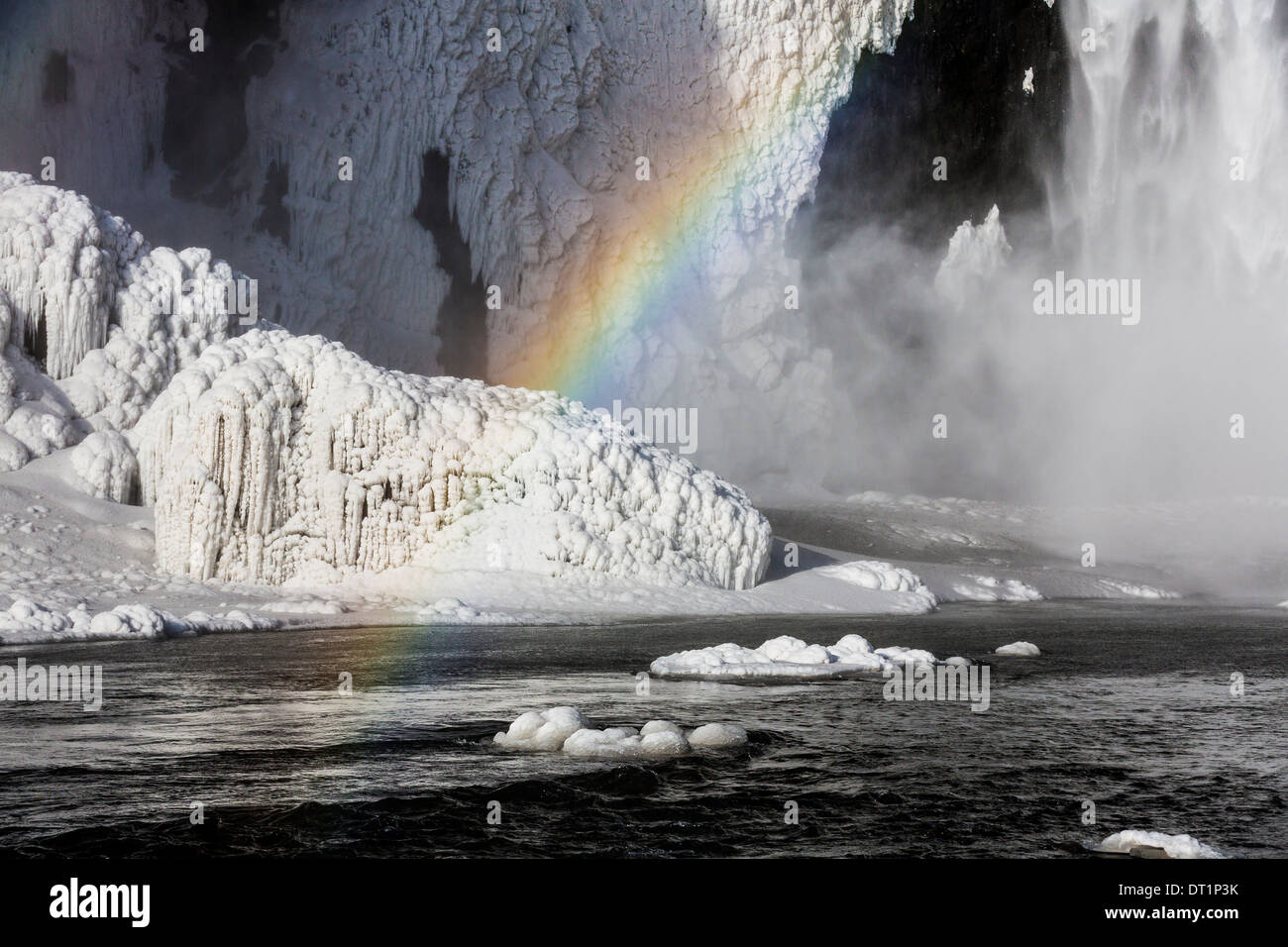 Rainbow over Skogafoss Waterfall in the Winter, Iceland Stock Photo