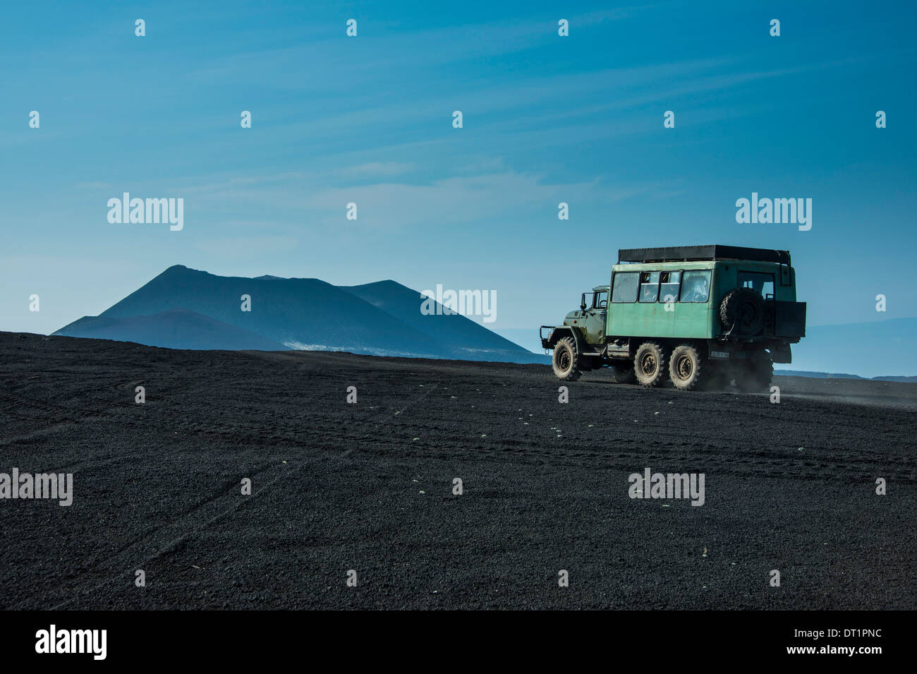 Russian truck drives through the lava sand field of the Tolbachik volcano, Kamchatka, Russia, Eurasia Stock Photo