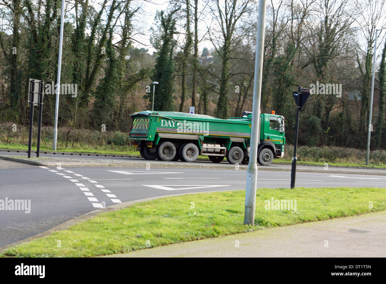 A truck leaving a roundabout in Coulsdon, Surrey, England. Stock Photo